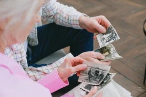 People looking at printed photos