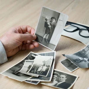 Person Holding Old Photos